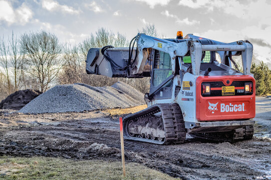 Bobcat skid steer loader to a pile of rubble
