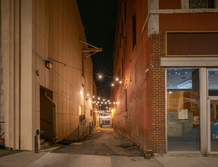 Night view of party lights in a back alley in downtown, Butte, Montana, USA