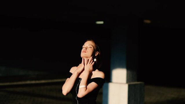 sexy woman model in black dress posing elegantly and sensually. The most beautiful woman with a reference appearance.