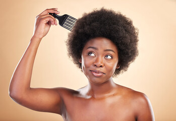 Afro, hair care and black woman in studio with comb for wellness, beauty and salon hairstyle. Haircare, treatment and happy African girl with curls, tools and beige background for luxury spa routine. - obrazy, fototapety, plakaty