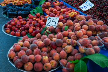 Nectarine sale in the traditional farm Turkish market, a counter filled with fresh fruits