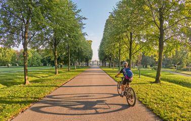 nice woman with electric mountain bike, cycling in moody morning light on the Neckar valley bicycle...