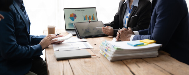 Young colleagues having great business conversations in a modern coworking office. Teamwork concept. Horizontal blurry background. Fireworks.