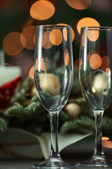 festive table on the background of a fir tree with a bokeh christmas and New Year's concept, interior details, selective focus