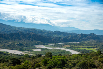 Fototapeta na wymiar River between mountains and forest in the department of Huila. Colombia.