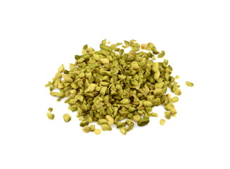 Ground, milled, crushed or granulated pistachio pile isolated on white background