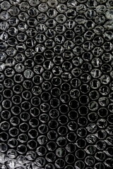 Black bubble plastic wrap surface. plastic with air balls on the surface used to pack glassware or electronics or sensitive items
