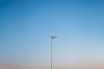 Minimalistic shot of isolated directional antenna for digital television. Blue hour.