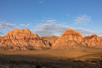 Scenic sunrise view of limestone peaks Mount Wilson, Bridge and Rainbow Mountain of Red Rock Canyon National Conservation Area in Mojave Desert near Las Vegas, Nevada, United States. Remote hiking