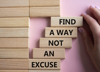 Find a Way not an Excuse symbol. Wooden blocks with words Find a Way not an Excuse. Beautiful pink...