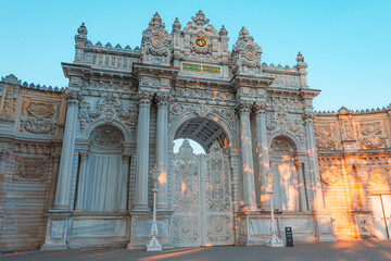 Fototapeta na wymiar Sunset shot of closed gate leading to former Ottoman Dolmabahce Palace, or Dolmabahce Sarayi, suited in Ciragan Street, Besiktas district, Istanbul, Turkey.