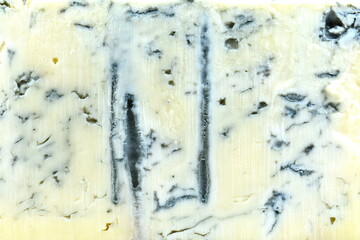 Blue cheese background and texture in the cut, top view, close up, macro