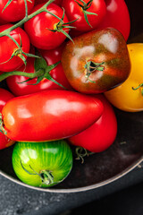 tomato assorted fresh tomatoes ripe fruit harvest type red, yellow, green vegetable meal food snack on the table copy space food background rustic top view