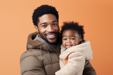 Obraz premium African-american father and son portrait on gradient studio background in neon. Beautiful male models in casual style, white shirt. Concept of human emotions, facial expression