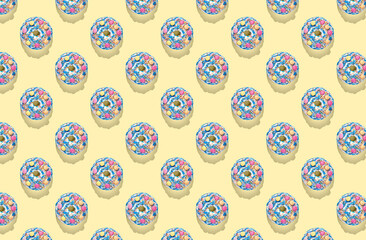 Pattern of blue donuts with glaze on yellow pastel background