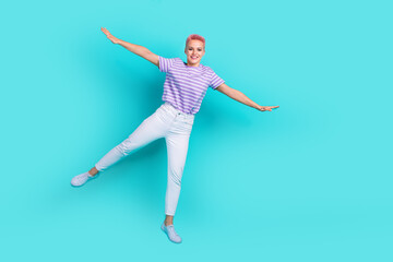 Full body size photo of flying wings jumper crazy girl pink hair overjoyed good mood feel light like bird isolated on blue color background
