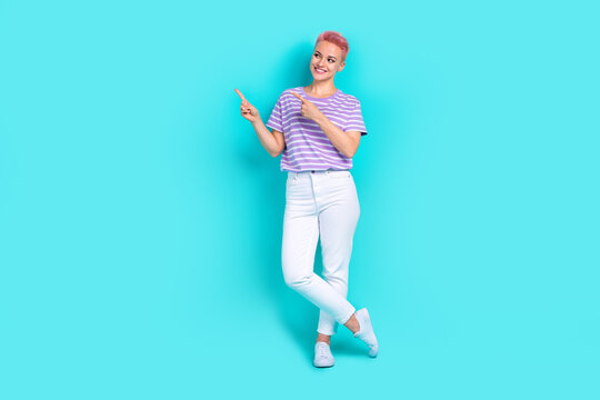 Full Body Size Photo Of Young Interested Promoter Dyed Hair Girl Wear Purple T Shirt Demonstrate Mockup Isolated On Blue Color Background