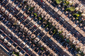 Aerial view directly above above rows of back to back terraced houses on a large council estate