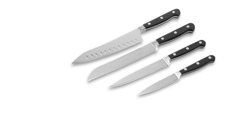 Stainless steel kitchen knives set on white background, space for a text.