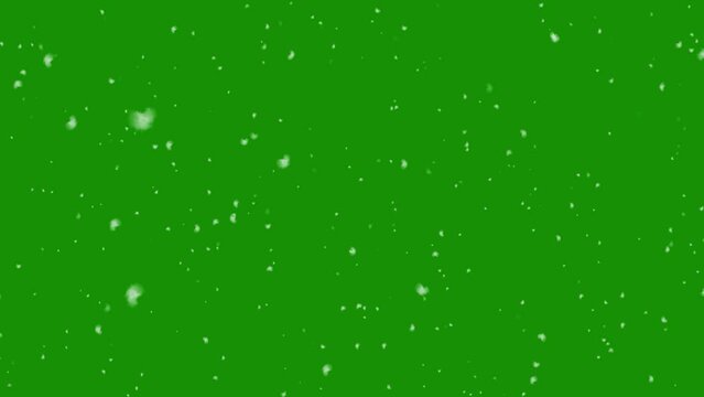 Snowfall overlay on green background. Winter slowly falling snow effect. Chroma key