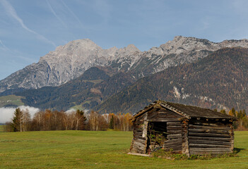 Fototapeta na wymiar A wooden hut below mountains near Zell am See in Austrian Alps