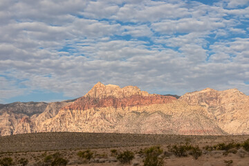 Scenic sunrise view of limestone peaks Mount Wilson, Bridge and Rainbow Mountain of Red Rock Canyon National Conservation Area in Mojave Desert near Las Vegas, Nevada, United States. Remote hiking