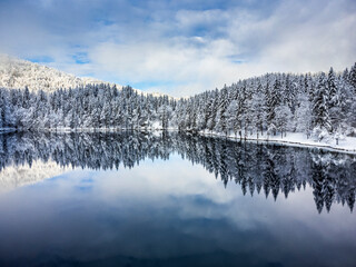 Magic and emotions of the Fusine lakes after the snowfall. Winter dress magic. Tarvisio. Top view