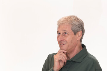 mature man looking at the blank space next to him and smiling