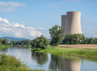 Green landscape and nuclear power plant .