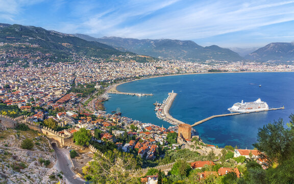 Alanya, Turkey. Aerial panoramic view from the mountain to the city, Kizil Kule (Red Tower) and marina. Alanya cityscape, Turkish resort. 
