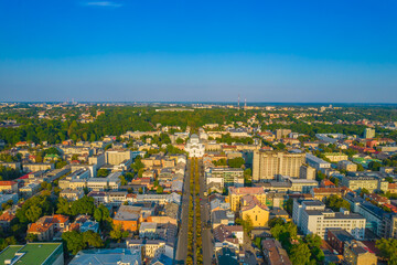 Fototapeta na wymiar Kaunas city center and Freedom Avenue, Laisves aleja in Lithuania. Aerial drone view of alley in summer.