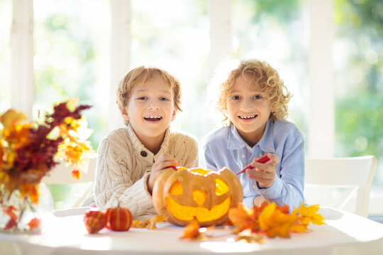 Family carving pumpkin for Halloween