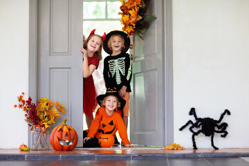 Kids trick or treat. Halloween fun for children.