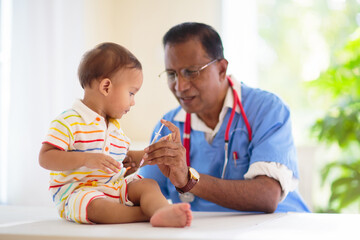 Doctor examining baby. Pediatrician with patient.