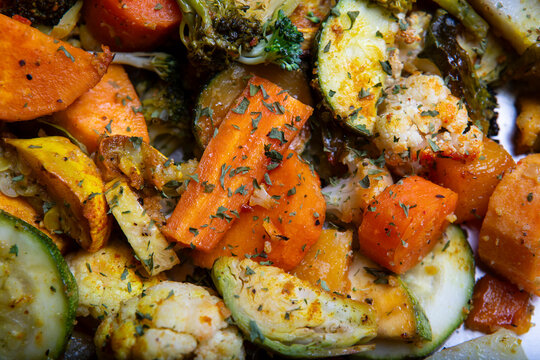 Assorted saut&eacute;ed vegetables, including sweet potato, squash, cauliflower, Brussel sprouts, carrots, broccoli and red peppers