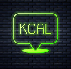 Glowing neon Kcal icon isolated on isolated on brick wall background. Health food. Vector