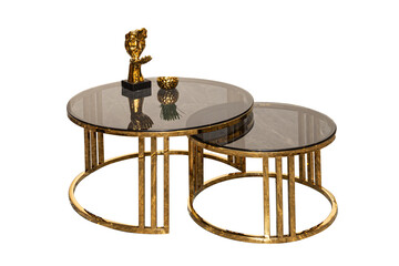 Set of 2 modular glass coffee tables with golden legs on a white background. isolated