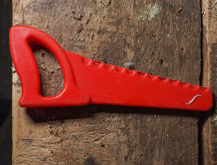Red toy wood saw