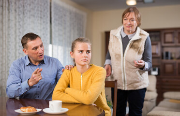 Offended girl after quarrel with parents sitting at home. High quality photo