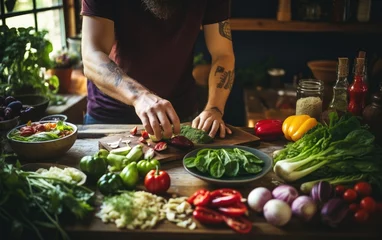 Foto op Canvas Man preparing healthy dinner using fresh vegetables in the kitchen © AZ Studio
