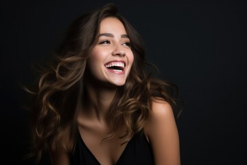 Happy girl 20 years old laughing - studio photo