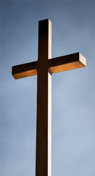 Photo of a tall cross on the rooftop of a building