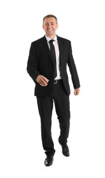 Mature Businessman Walking Forward On White Background