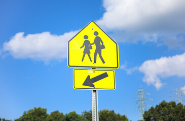 Pedestrian sign signifies safety, crosswalks, and shared public spaces, emphasizing pedestrian rights and traffic awareness