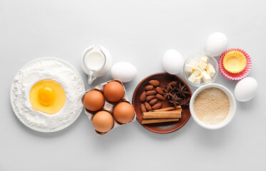 Composition with different ingredients for preparing bakery on light background