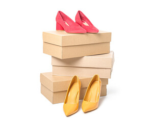 Cardboard boxes with stylish female shoes on white background