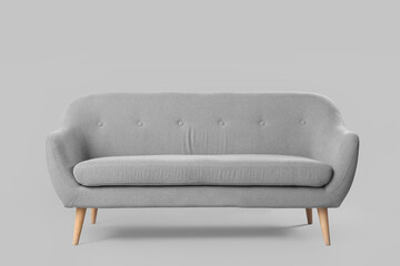 Fototapeta na wymiar Cozy sofa on grey background
