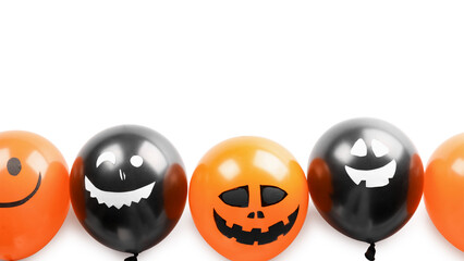 Creative Halloween balloons on white background