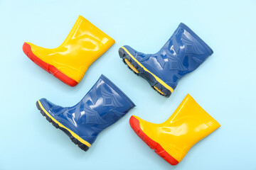 Different gumboots on blue background