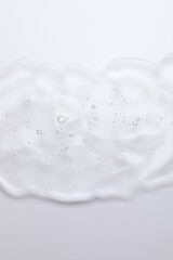 Sample of cosmetic oil on white background, top view